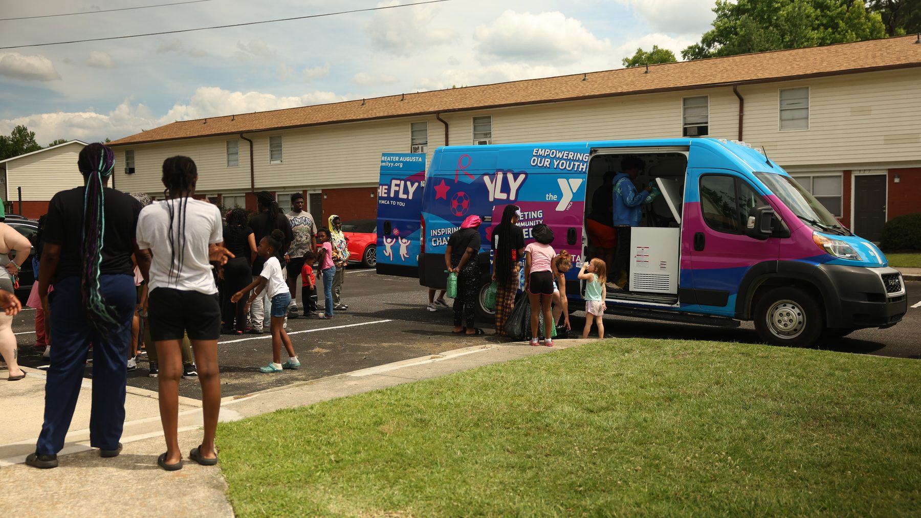 YMCA mobile outreach serving families in a neighborhood